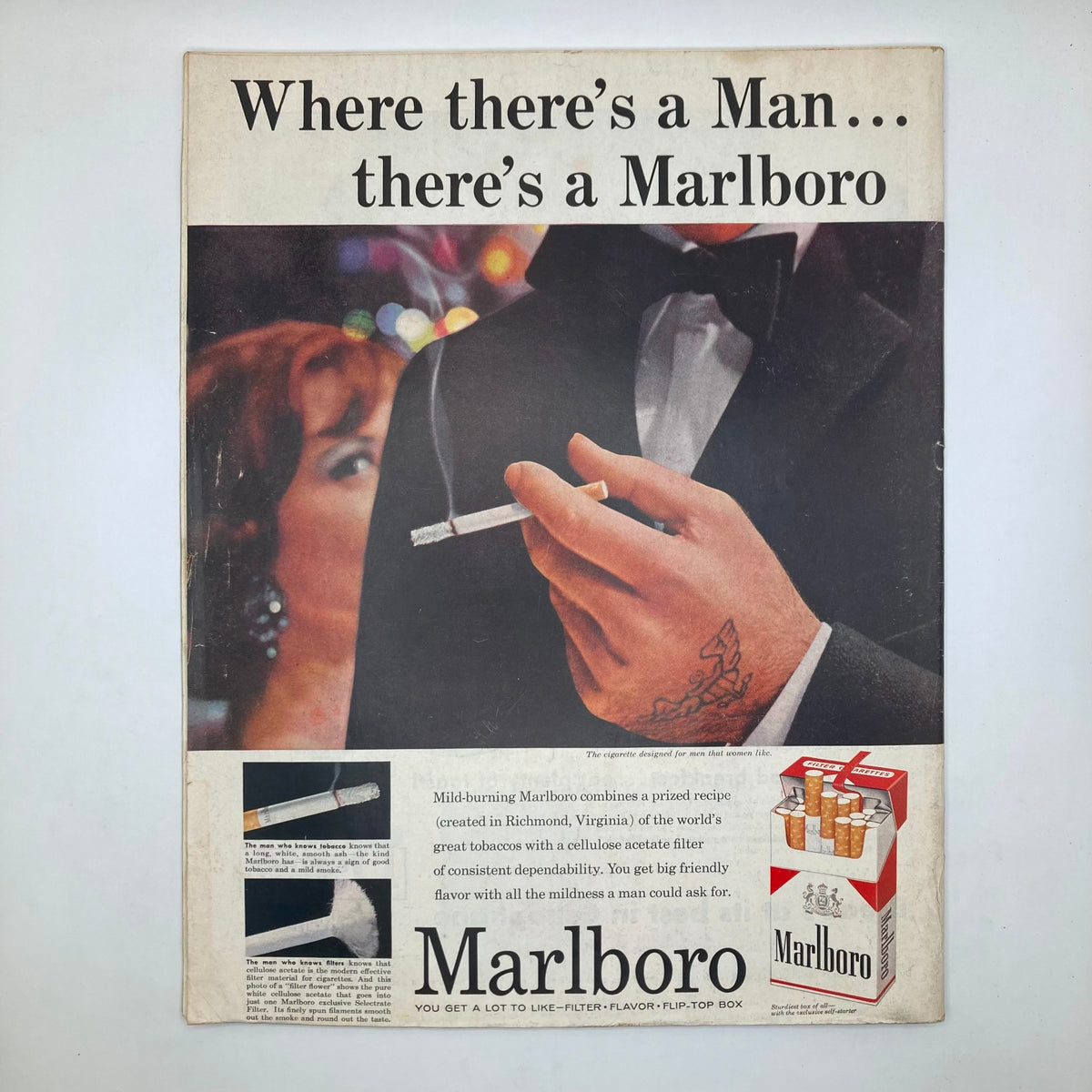 Advertisement page from the Saturday Evening Post Magazine March 8, 1958 presenting a Marlboro cigarette ad featuring a well-dressed man with a cigarette and a stylish woman in the background.