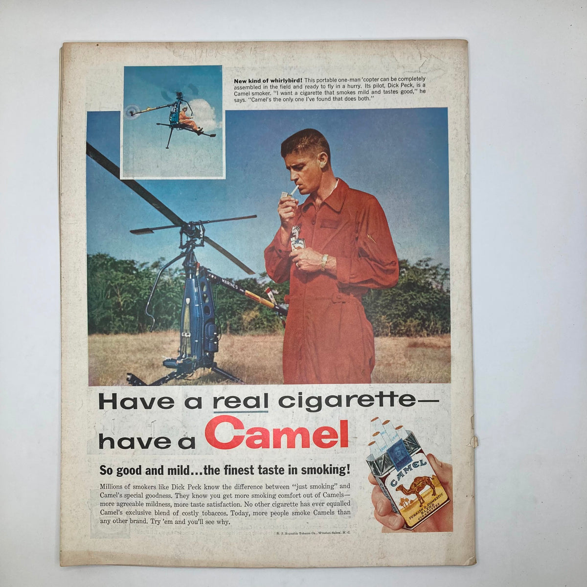 Advertisement page from the Saturday Evening Post Magazine February 1, 1958, featuring a young pilot with a helicopter promoting Camel cigarettes, illustrating mid-20th century advertising aesthetics.