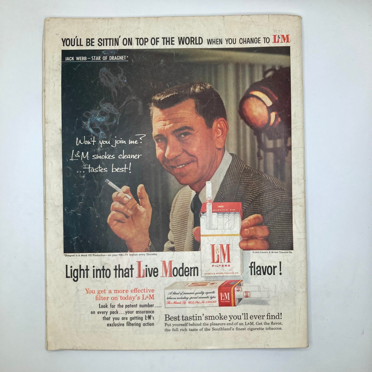 Back cover of Saturday Evening Post Magazine May 24 1958 featuring an advertisement for L&M cigarettes with actor Jack Webb.
