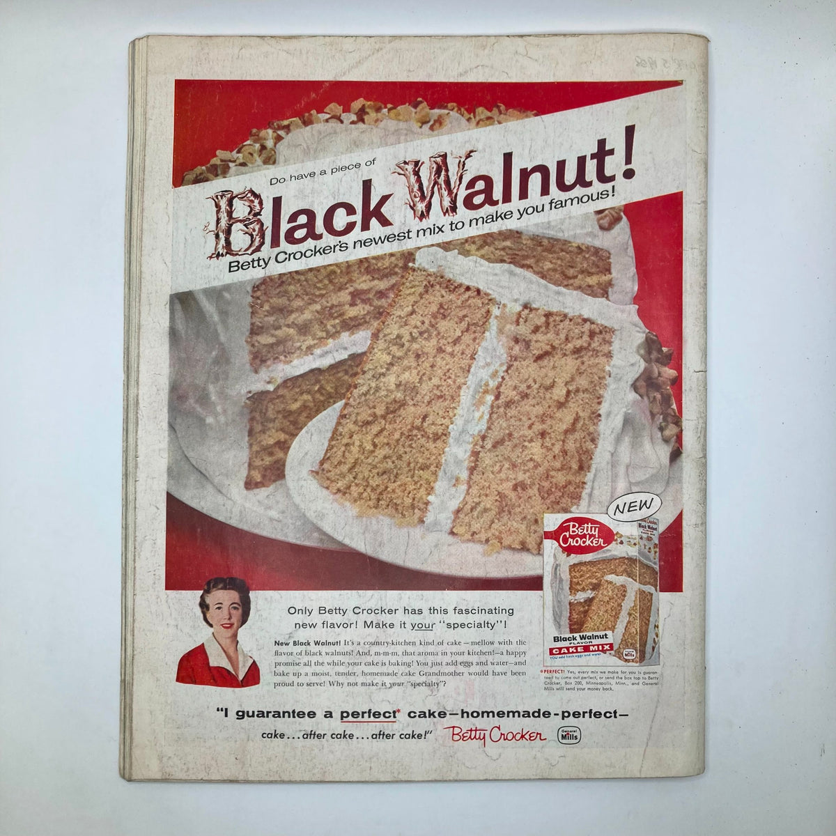 Vintage advertisement for Betty Crocker's Black Walnut cake mix featured in the Saturday Evening Post Magazine February 22, 1958. The ad showcases a slice of the cake on a plate, emphasizing its homemade qualities and appeal.