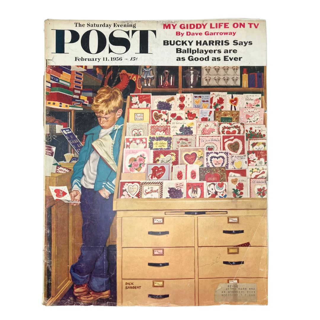 Cover of Saturday Evening Post Magazine February 11 1956, featuring a young boy shopping for Valentine's Day cards, artwork by Dick Sargent.