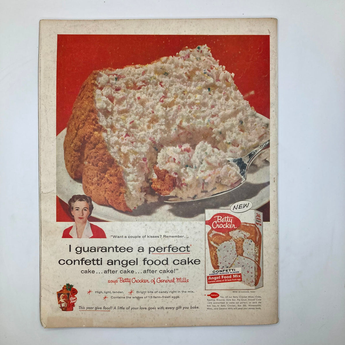 Cover of Saturday Evening Post Magazine December 1 1956 featuring an advertisement for Betty Crocker's confetti angel food cake, showcasing a delicious cake with a woman in the corner.
