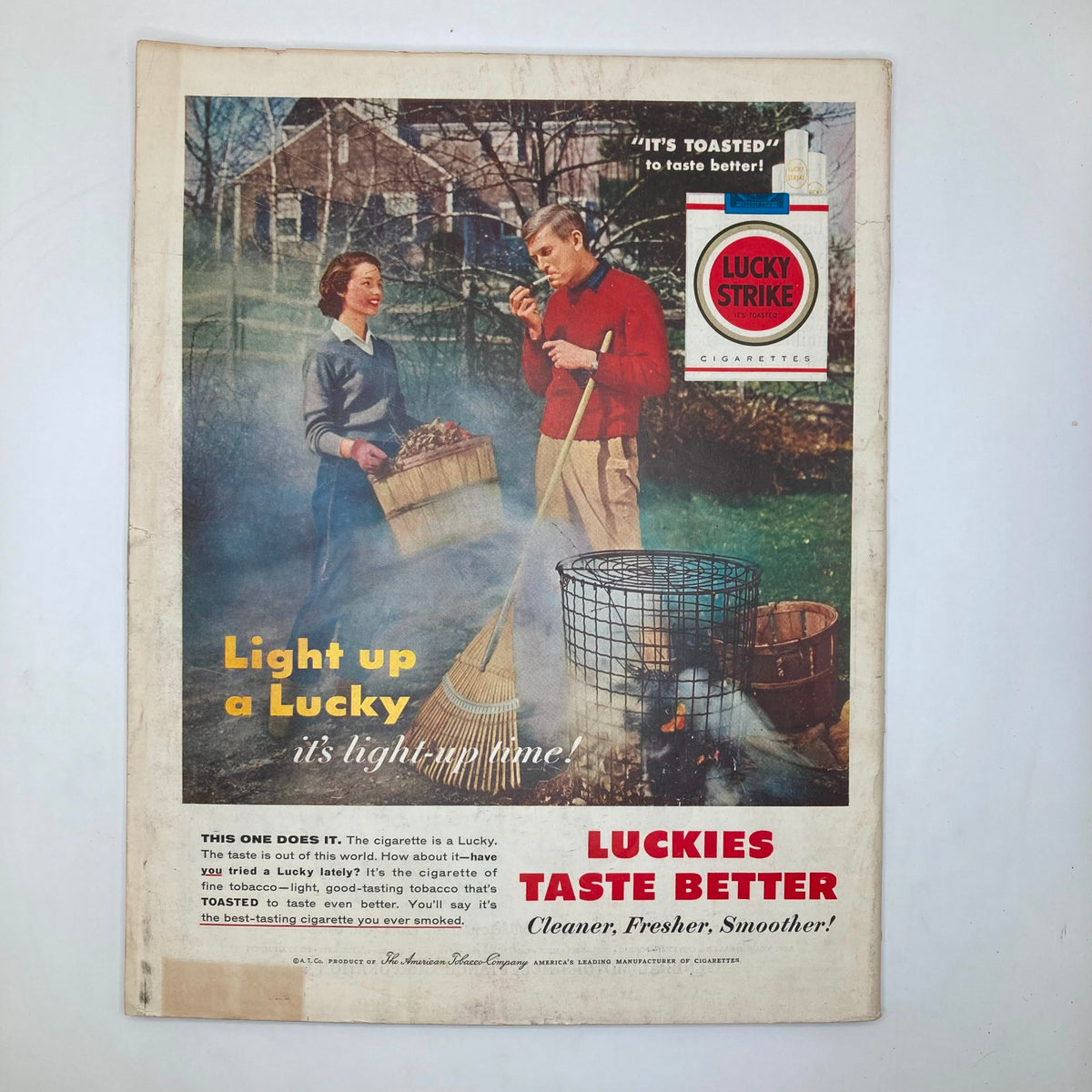 Back cover of the Saturday Evening Post Magazine from November 10, 1956, displaying a vintage advertisement for Lucky Strike cigarettes, emphasizing mid-century marketing styles.