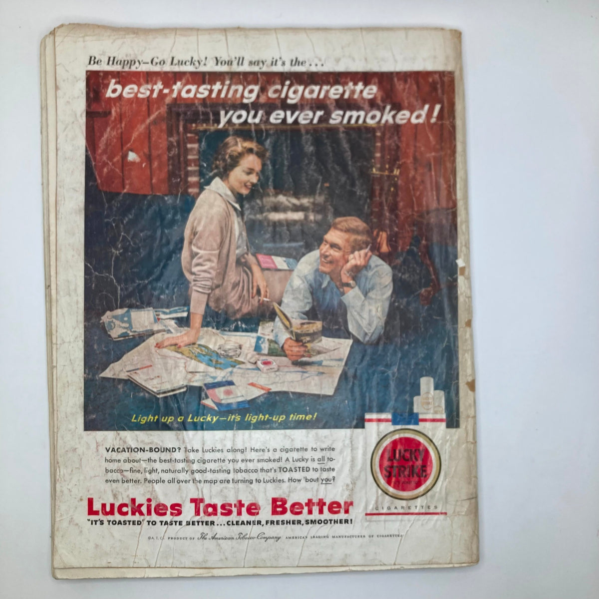 Advertisement for Lucky Strike cigarettes from the Saturday Evening Post Magazine April 27 1957, featuring a couple discussing their vacation plans, highlighting vintage cigarette marketing.