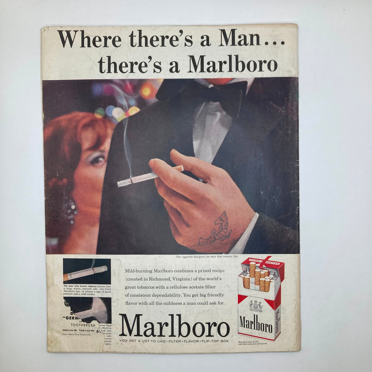 Back cover of The Saturday Evening Post magazine, showing a Marlboro advertisement with an elegant man holding a cigarette, promoting the brand.