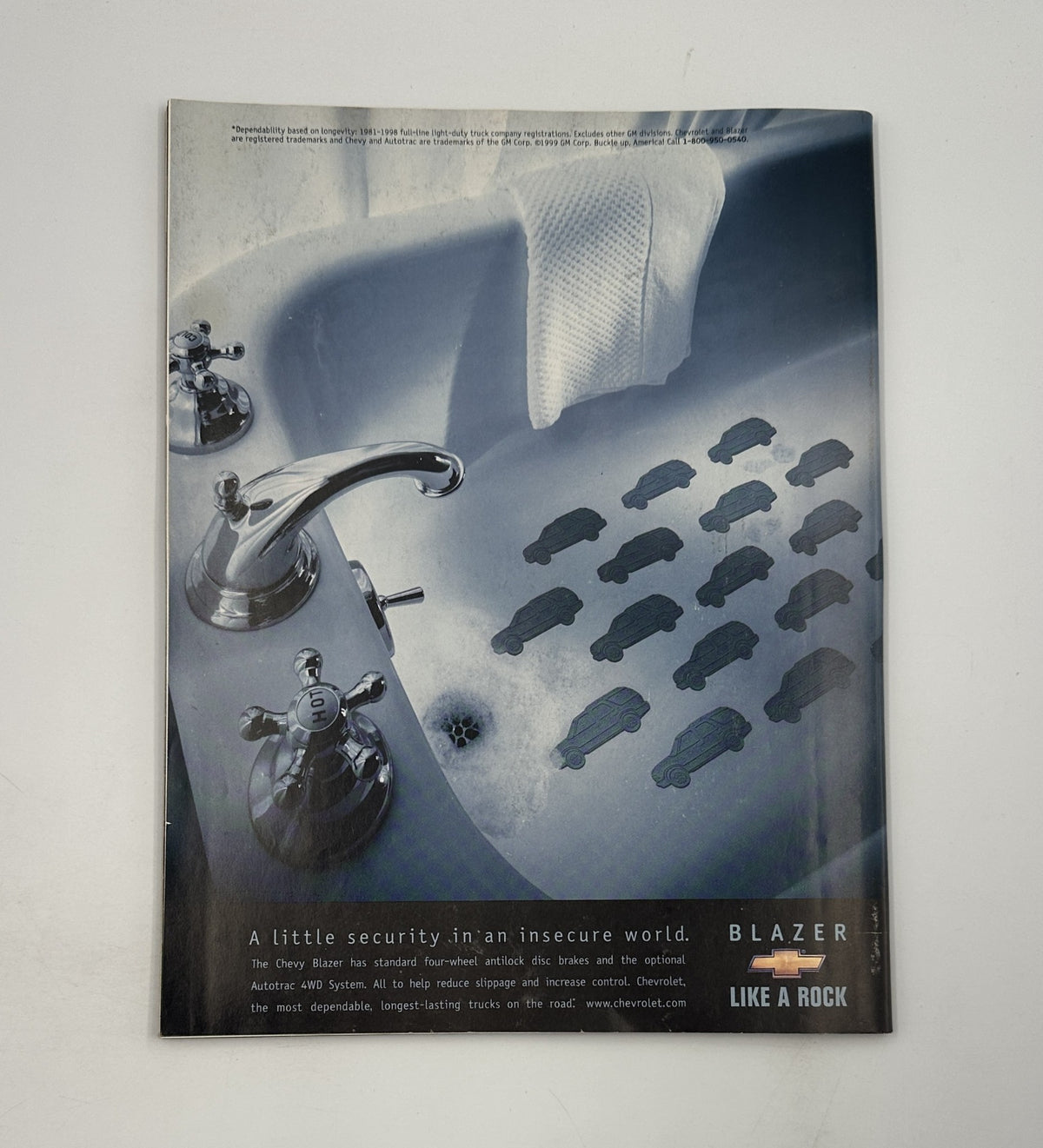 Advertisement for the Chevy Blazer, showcasing a bathtub filled with toy car silhouettes. The message emphasizes security in an insecure world, promoting the vehicle's reliable features. Time Magazine October 18, 1999 Steve Jobs Apple Pixar Toy Story 2 VG.
