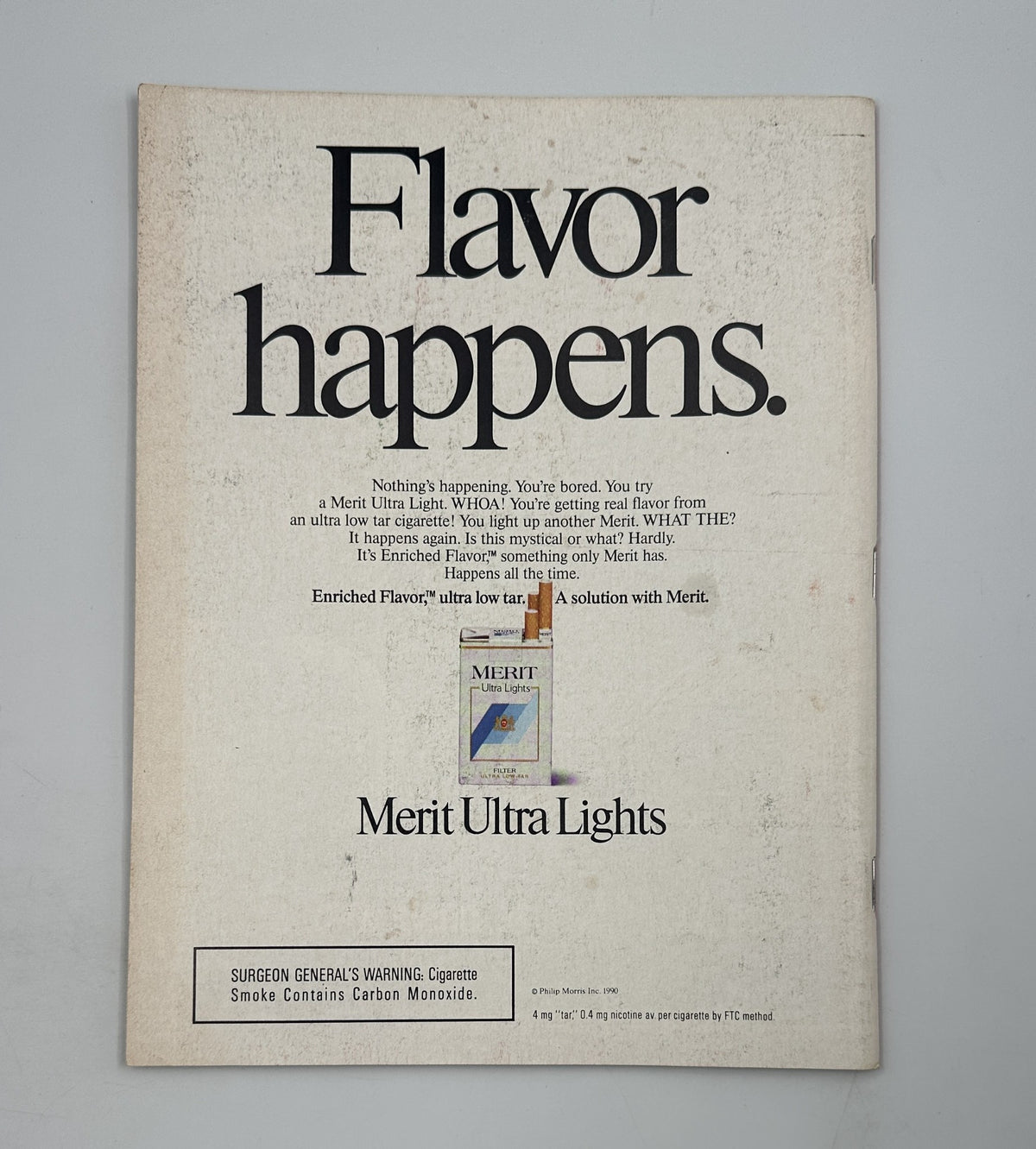 Back cover of Time Magazine September 24, 1990 featuring an advertisement for Merit Ultra Lights cigarettes, showcasing bold text that reads 'Flavor happens'. This vintage ad accompanies the cover story about King Fahd and the Gulf War, including key figures like Bush and Saddam Hussein.