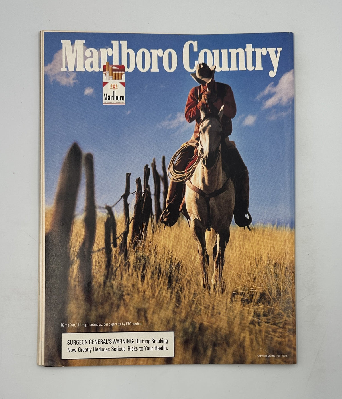 Cover of Marlboro Country magazine showing a cowboy riding a horse in a vast open landscape, promoting themes of outdoor lifestyle and freedom related to smoking products.