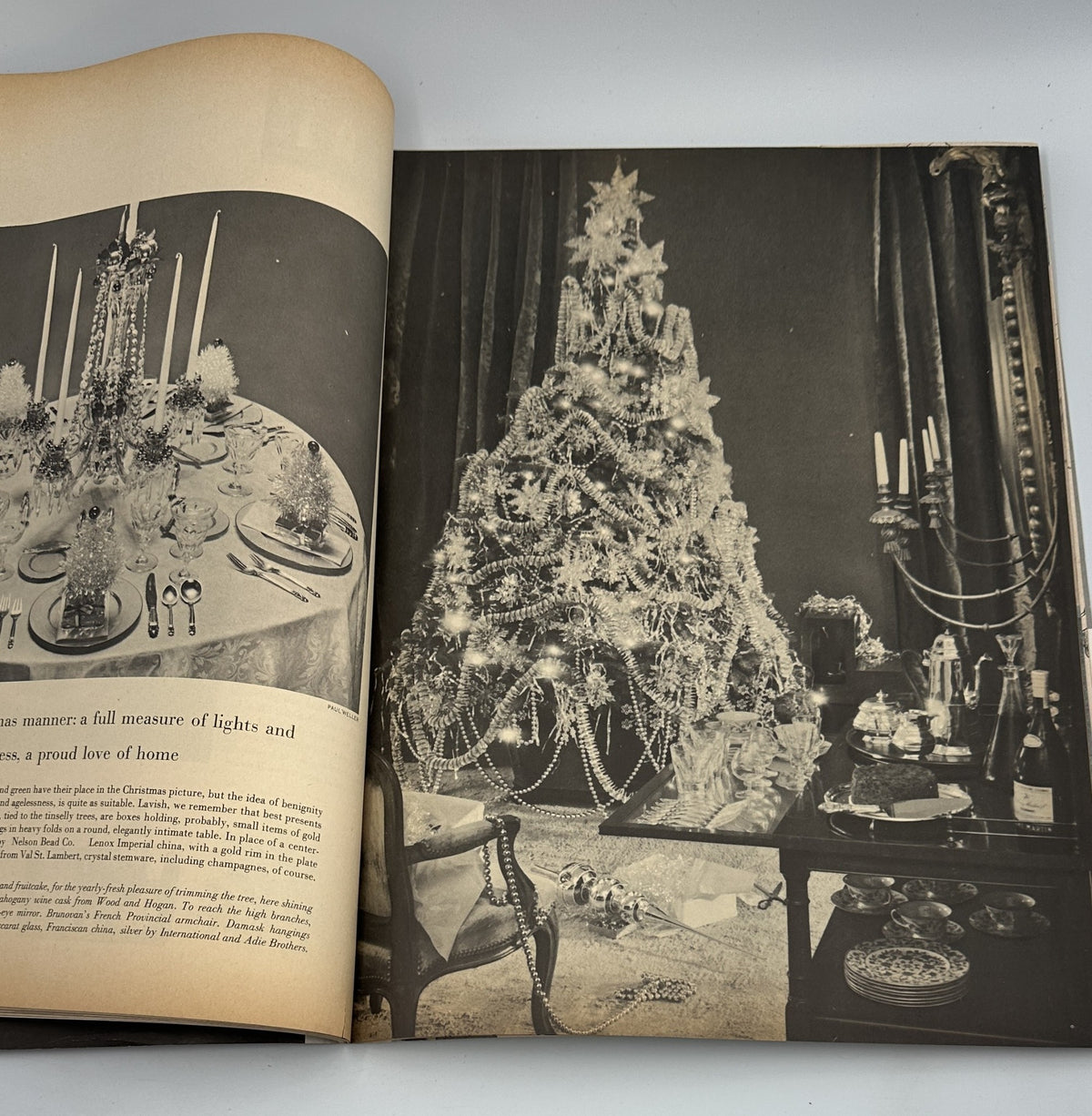 Photograph of an elegant Christmas scene from Flair Magazine November 1950, featuring a beautifully decorated Christmas tree and festive dining setup.