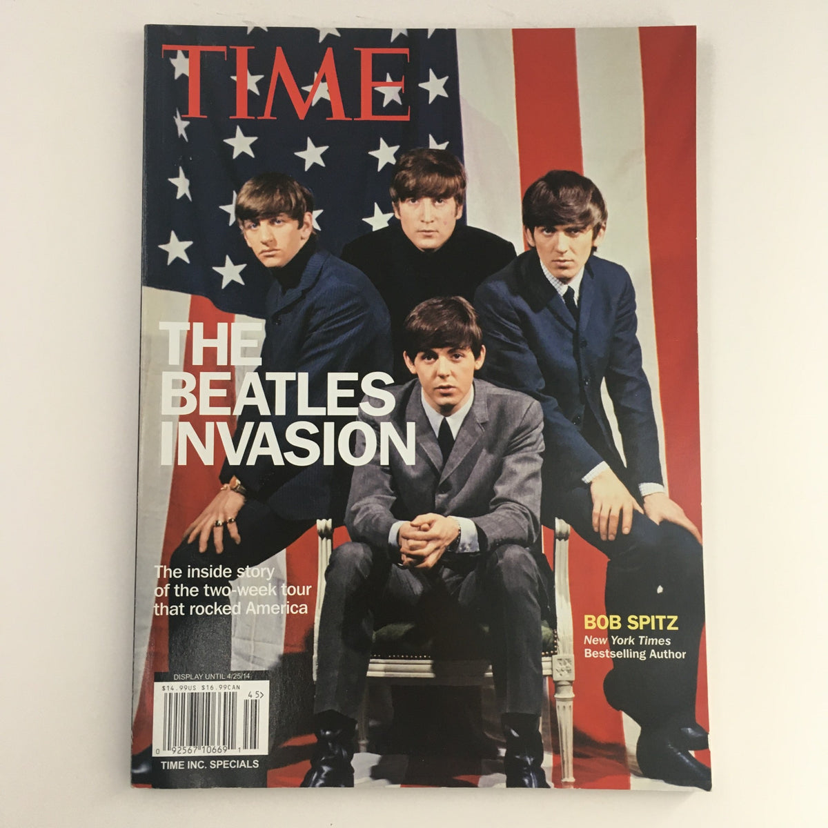 Cover of Time Magazine 2014 featuring 'The Beatles Invasion', showcasing the iconic band members in the context of their two-week tour in America.