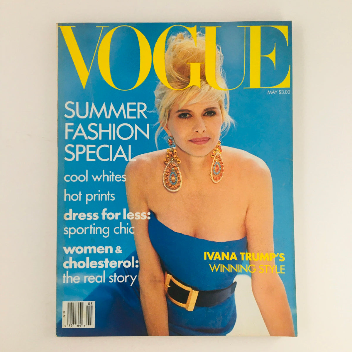 Cover of Vogue Magazine May 1990 featuring Ivana Trump's Winning Style with a bright blue background and bold yellow title. Highlights include Summer Fashion Special and women's fashion topics.