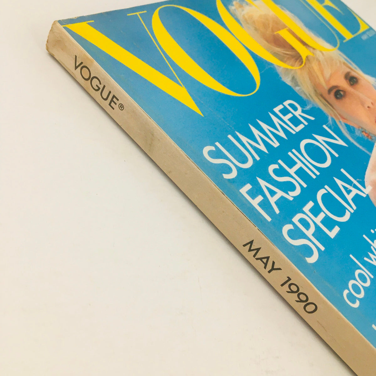 Side view of Vogue Magazine May 1990 showcasing the spine with the date and title clearly visible. The magazine features Ivana Trump's Winning Style and highlights summer fashion trends.