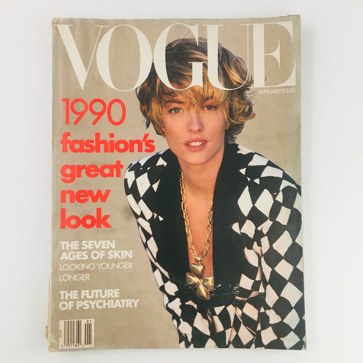 Vogue Magazine January 1990 cover featuring German model Tatjana Patitz in a stylish black and white outfit, highlighting fashion's great new look.