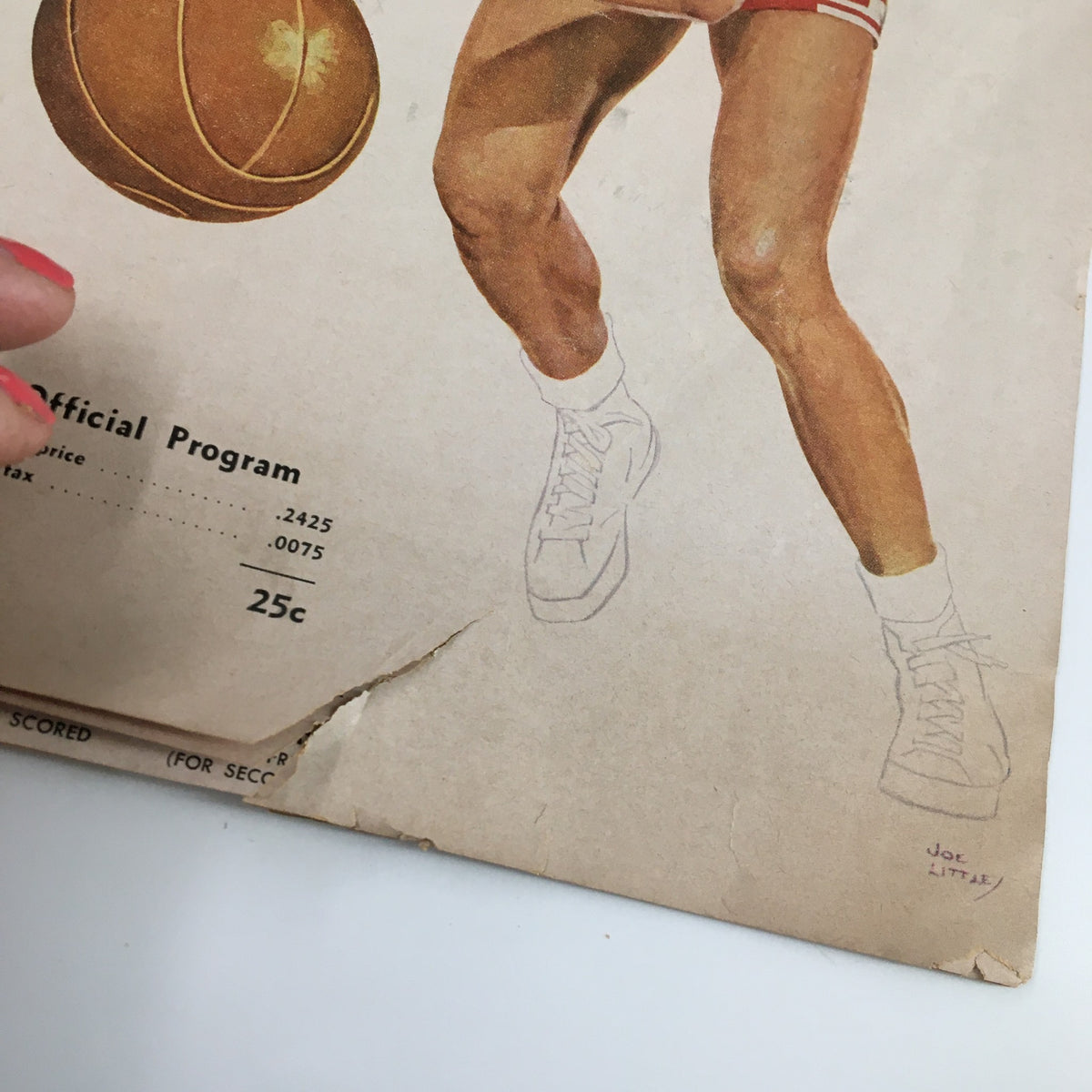Close-up view of the February 5 1960 NCAA Basketball UCLA vs New Mexico State The Tipoff Program, highlighting a detailed illustration of a basketball and features minor vintage wear.