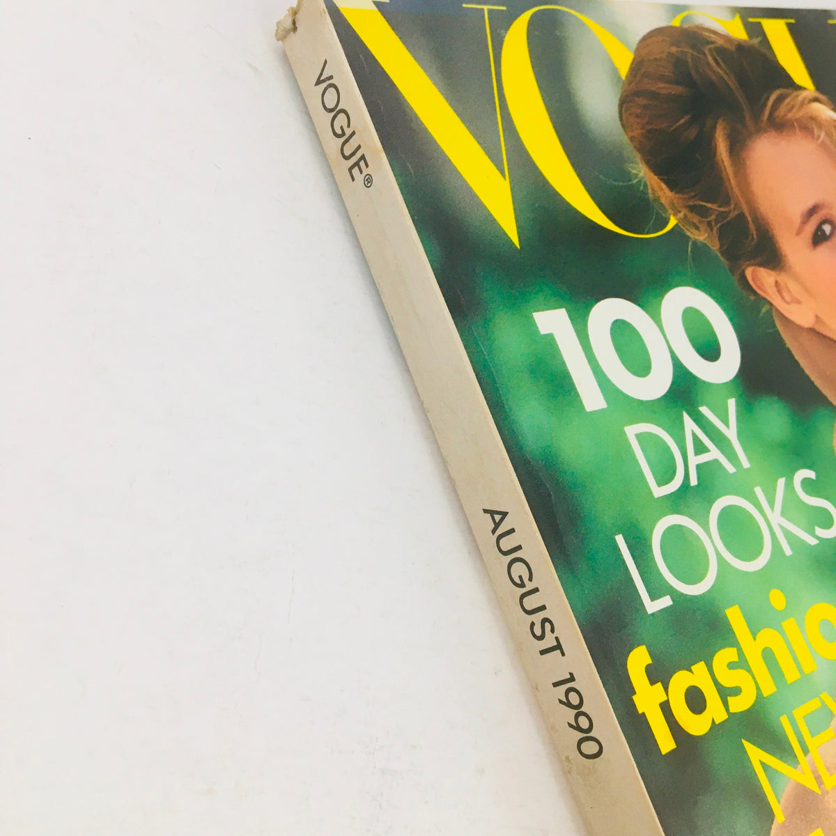 Side view of Vogue Magazine August 1990 showing the spine with publication details, showcasing German model Claudia Schiffer on the cover.
