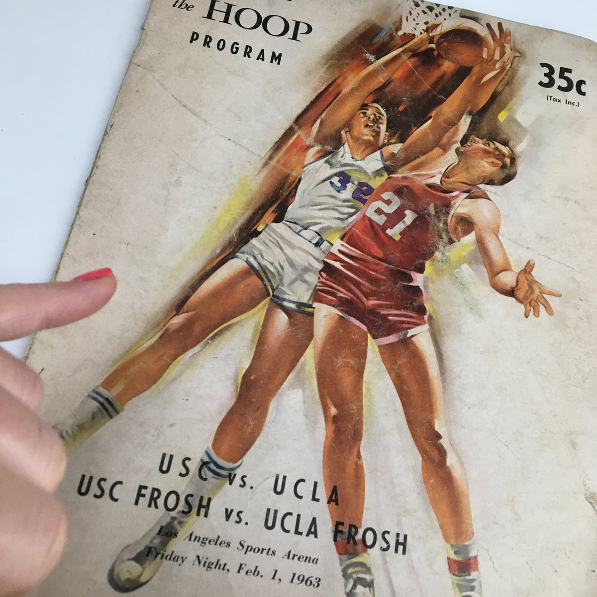 Close-up of the February 1, 1963 NCAA Basketball USC vs UCLA The Hoop Official Program cover highlighting player graphics.