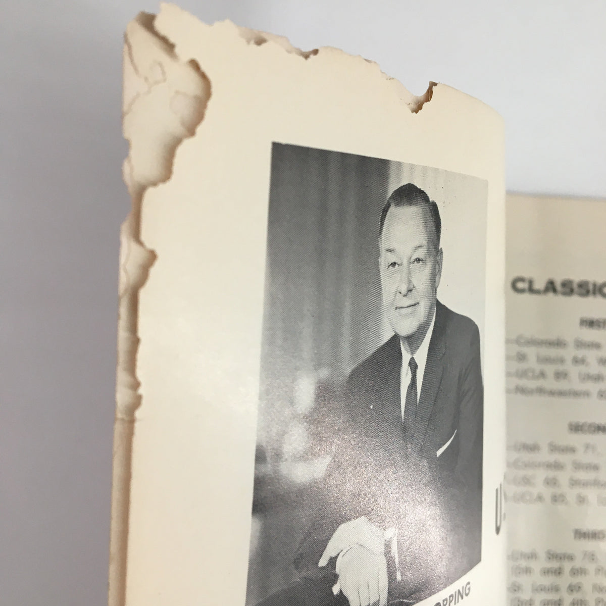 Close-up of the damaged edge of a page from the December 26, 1963 NCAA USC vs UCLA Basketball Classic Official Program.