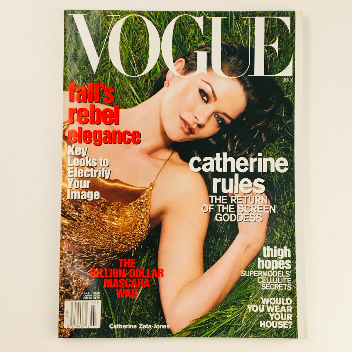 Cover of Vogue Magazine July 2001 featuring Welsh actress Catherine Zeta-Jones, showcasing fashion trends with bold text and a glamorous design.