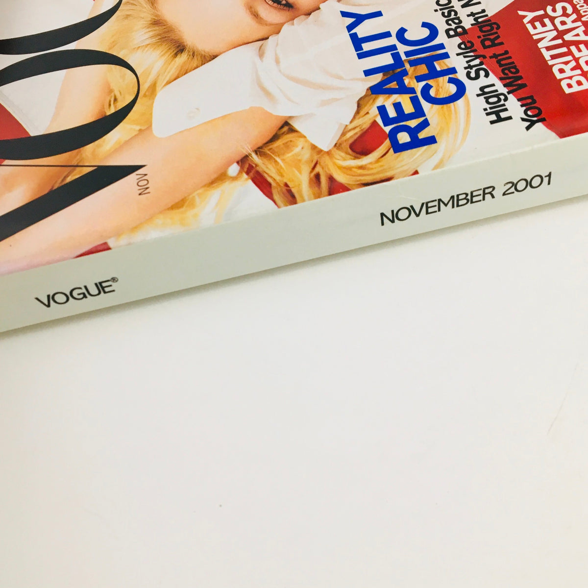 Close-up of Vogue Magazine November 2001 displaying the title and date, featuring Britney Spears, known as Madonna's heir apparent, capturing the essence of early 2000s fashion.