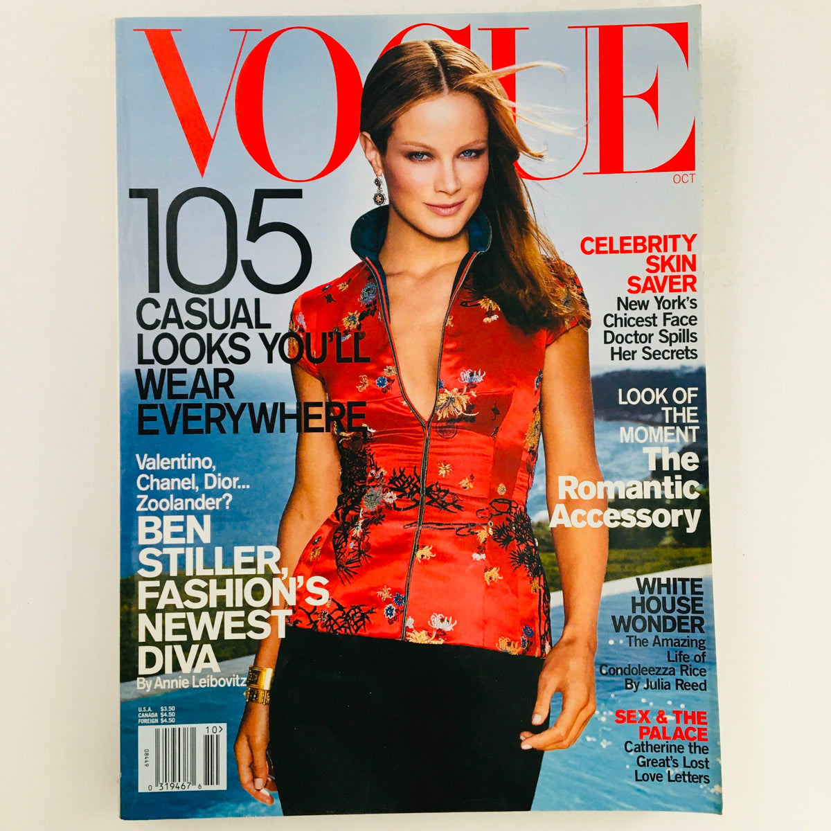 Vogue Magazine October 2001 cover featuring American model Carolyn Murphy in a vibrant red floral dress, showcasing 105 casual looks you'll wear everywhere.