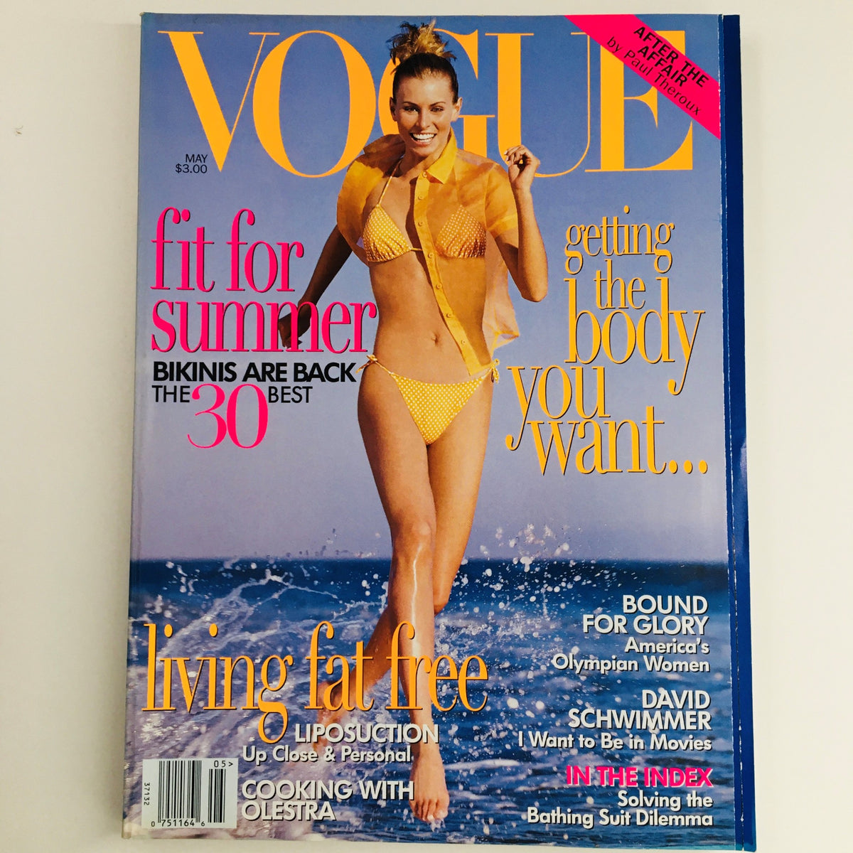 Cover of Vogue Magazine from May 1996 featuring American supermodel Niki Taylor in a yellow bikini, promoting summer fashion and health tips.