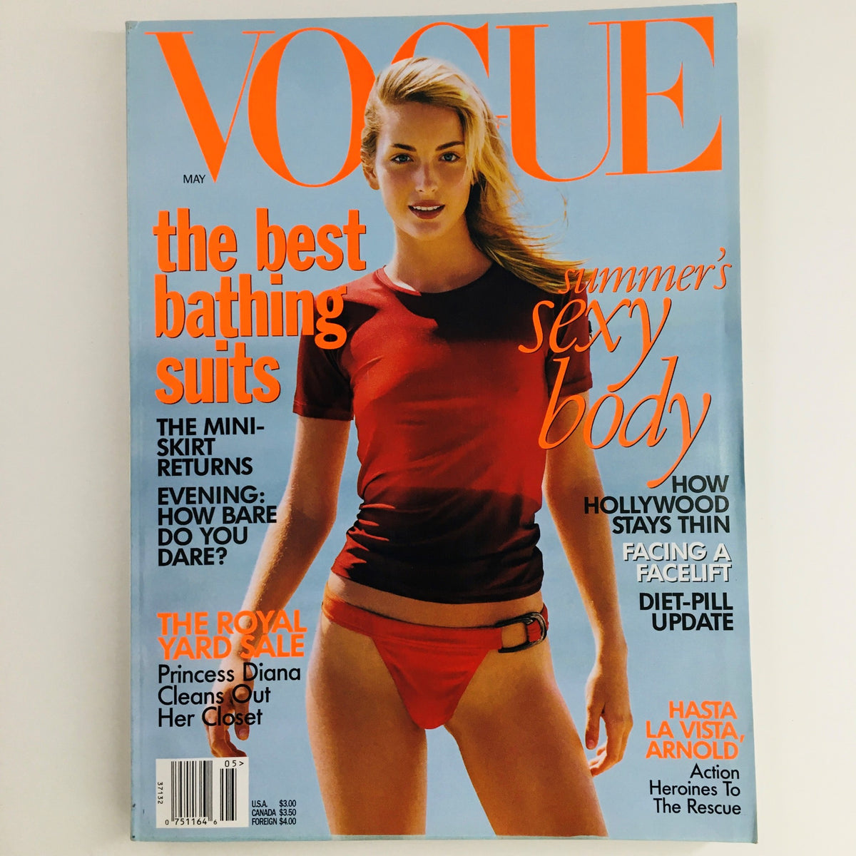 Cover of Vogue Magazine May 1997 featuring South African model Georgina Grenville, showcasing summer fashion trends and bathing suits, highlighting a notable era in vintage fashion.