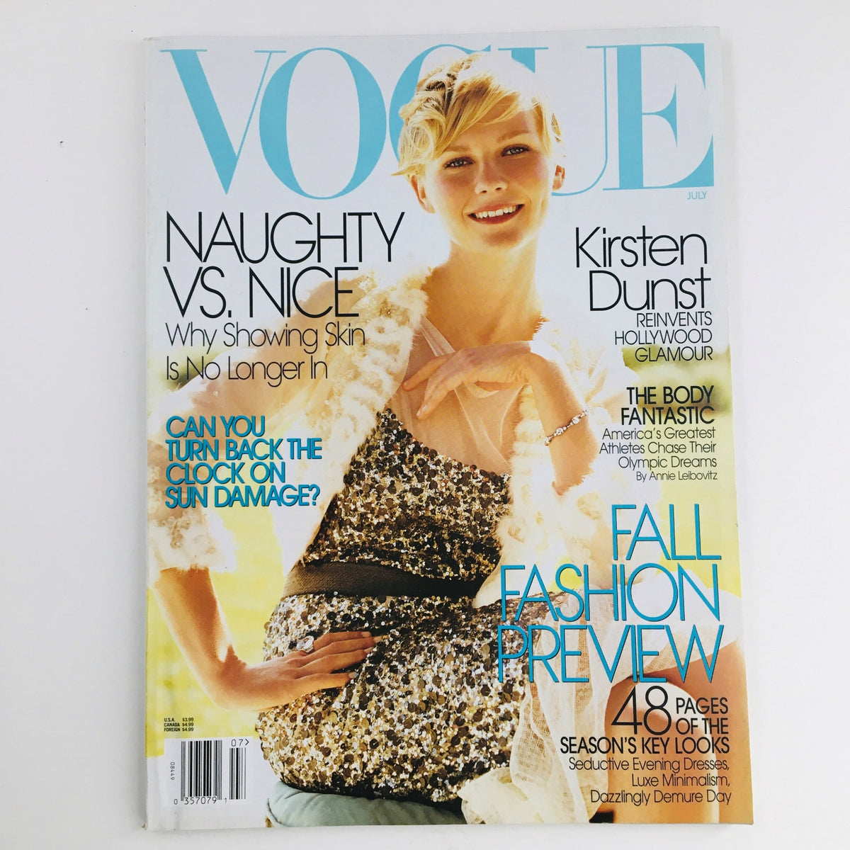 Vogue Magazine July 2004 featuring Kirsten Dunst on the cover, showcasing fashion trends of the early 2000s.