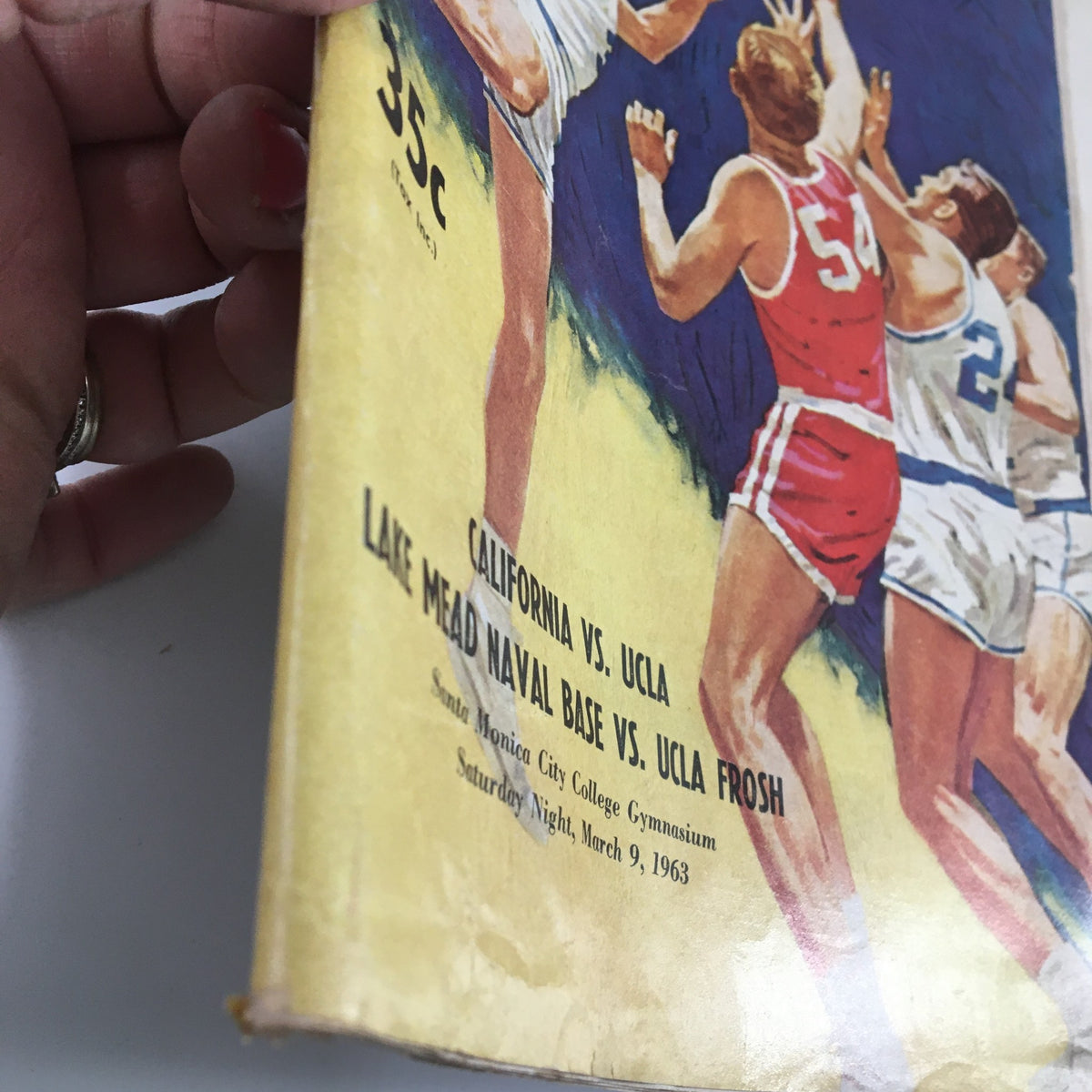 Side view of the March 9 1963 NCAA Basketball California vs UCLA The Hoop Official Program showing the cover detail and the title.