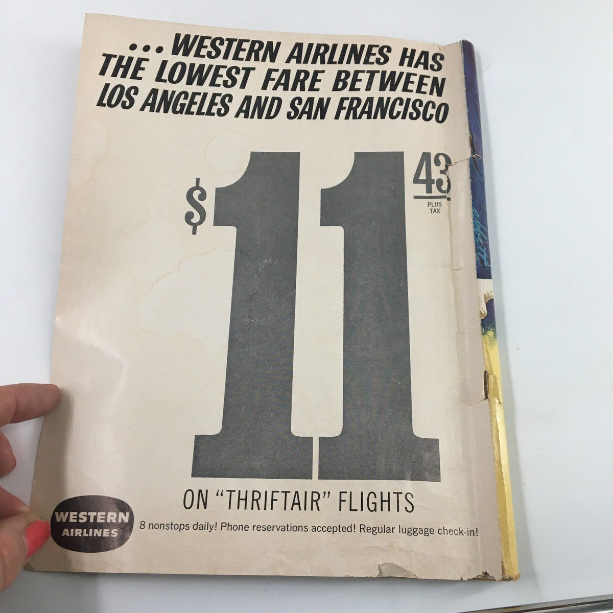 Advertisement for Western Airlines on the back cover of the March 9 1963 NCAA Basketball California vs UCLA Official Program, highlighting low fares for flights.