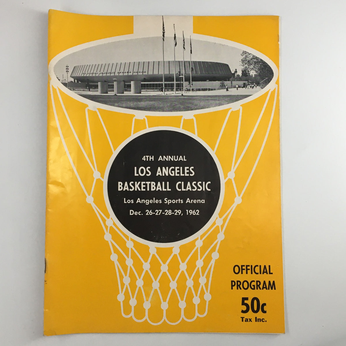 Cover of the December 26 1962 NCAA Utah State vs UCLA Basketball Classic Official Program, featuring a bold yellow design with a basketball hoop and the event details.