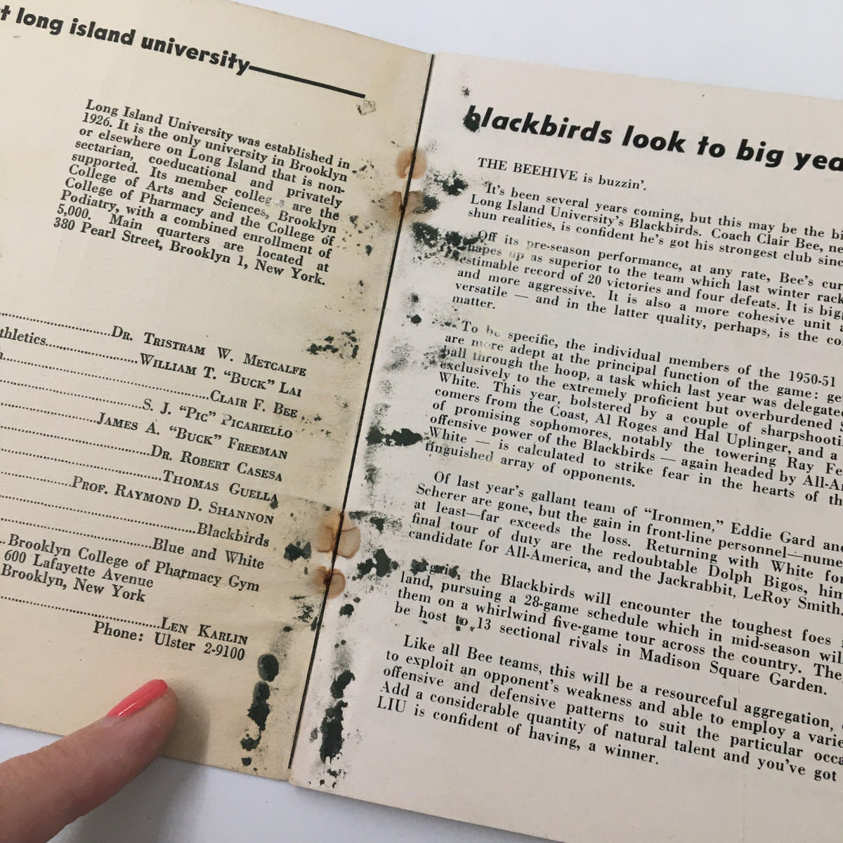 Interior page of the 1950-1951 NCAA Basketball Long Island University Official Program showing printed text and stains, highlighting historical information about the Blackbirds team.