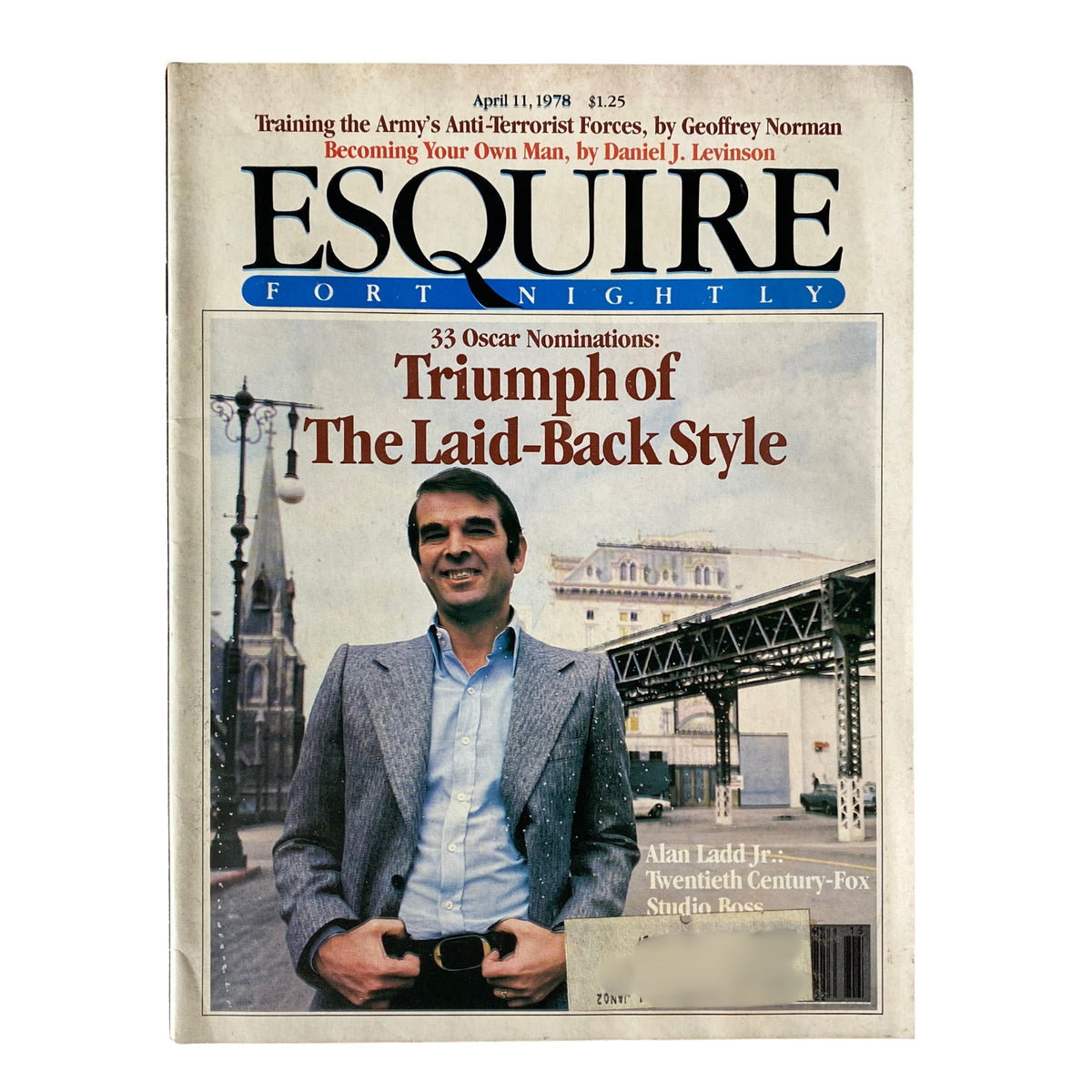 Esquire Magazine April 11, 1978 featuring Alan Ladd Jr., Twentieth Century-Fox Boss, on the cover. The image showcases a stylish man in a tailored suit standing in front of the studio lot.