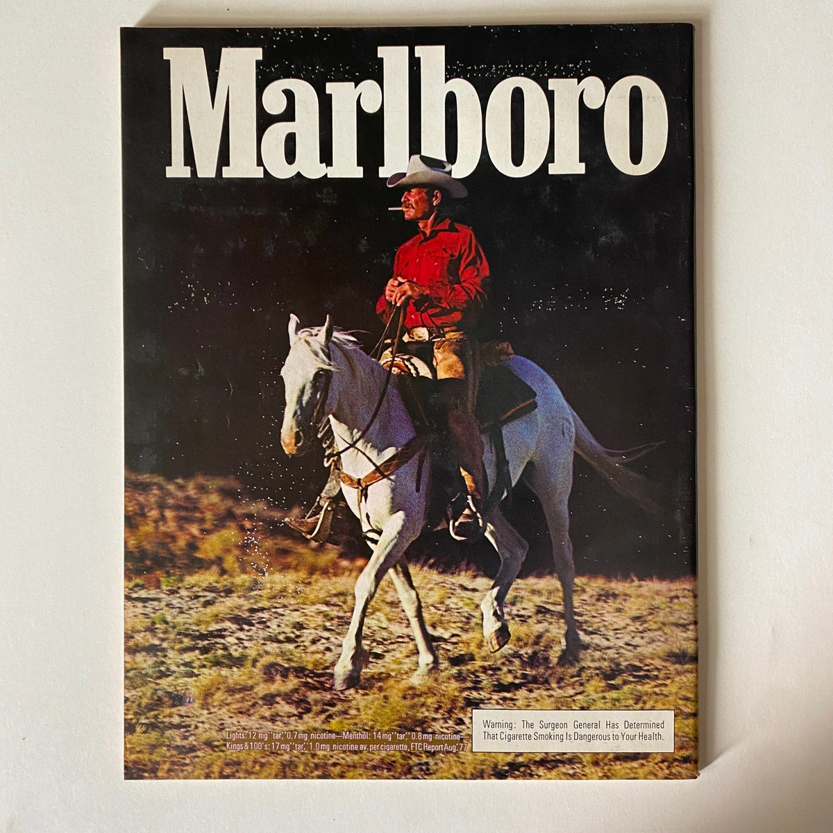 Vintage Marlboro magazine cover featuring a cowboy on horseback, contrasting with the Esquire issue, representing the rich American culture of the late 1970s.