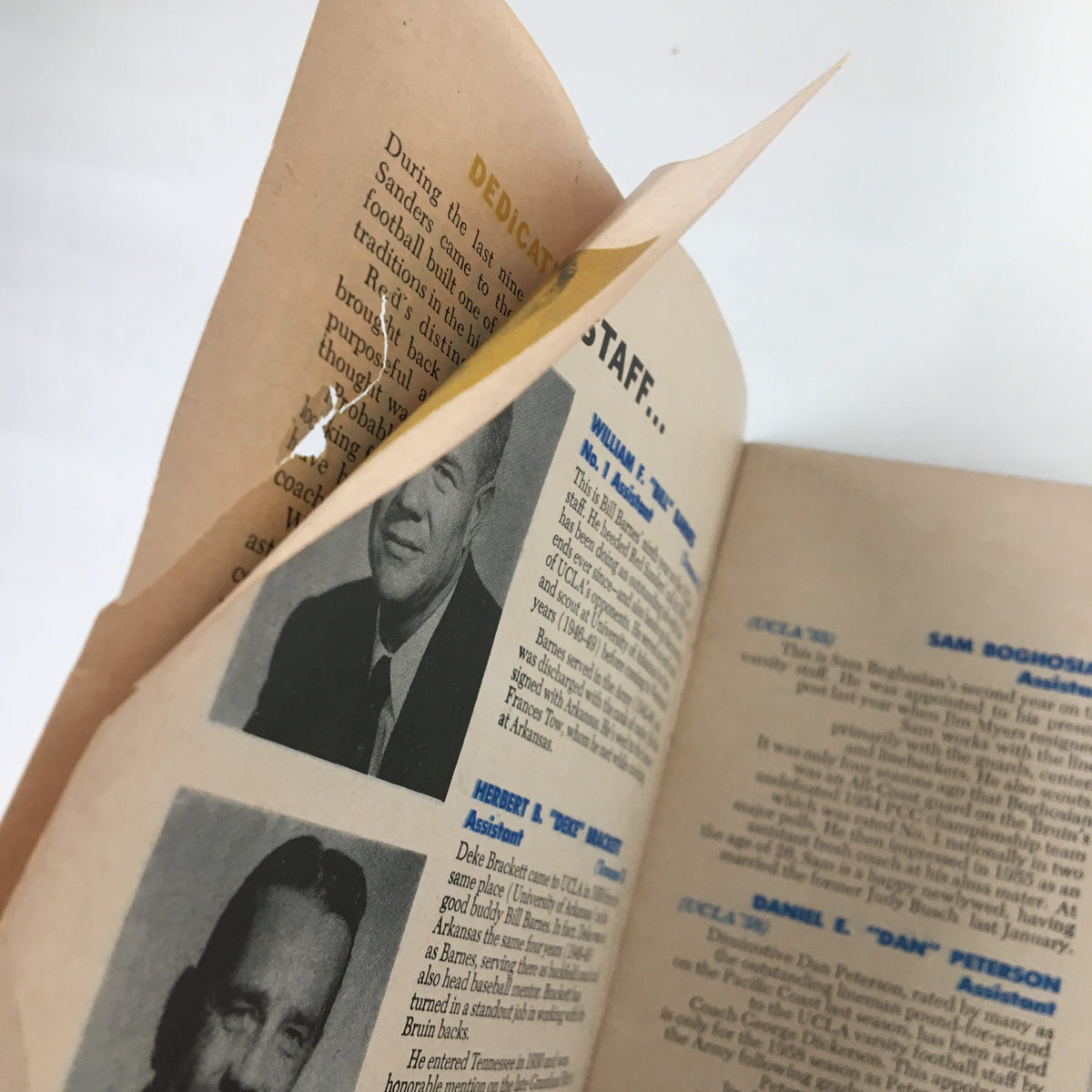 Inside view of the 1958 NCAA Packard Bell UCLA Bruins Football Official Program highlighting the dedication page with staff photos.