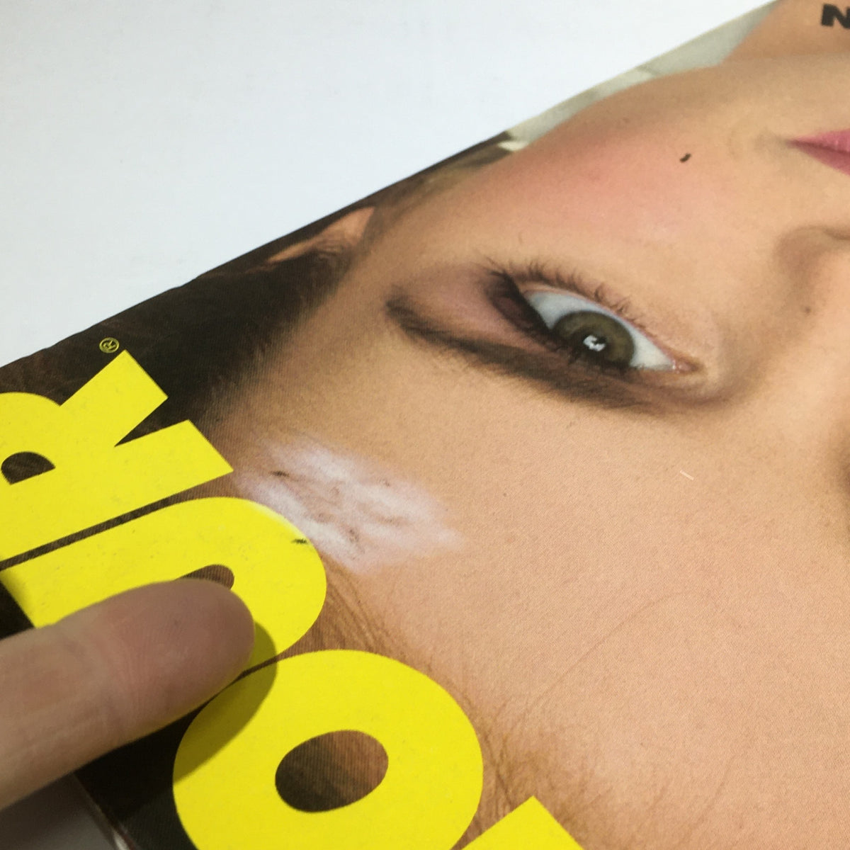Close-up of the July 1982 Glamour Magazine cover with Jacki Adams, highlighting wear and tear characteristic of vintage magazines while retaining its collectibles charm.