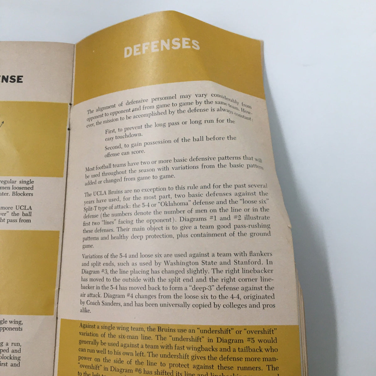 1958 NCAA Packard Bell UCLA Bruins Football Official Program page discussing defensive alignments and strategies used by the UCLA Bruins during the 1958 football season.