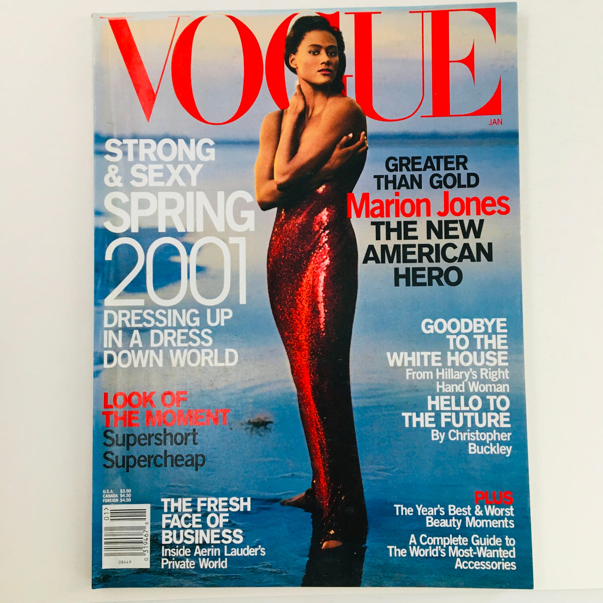 Vogue Magazine January 2001 featuring track and field athlete Marion Jones on the cover, showcasing her in a striking pose dressed in a glamorous outfit, symbolizing athletic excellence and cultural moments in sports history.