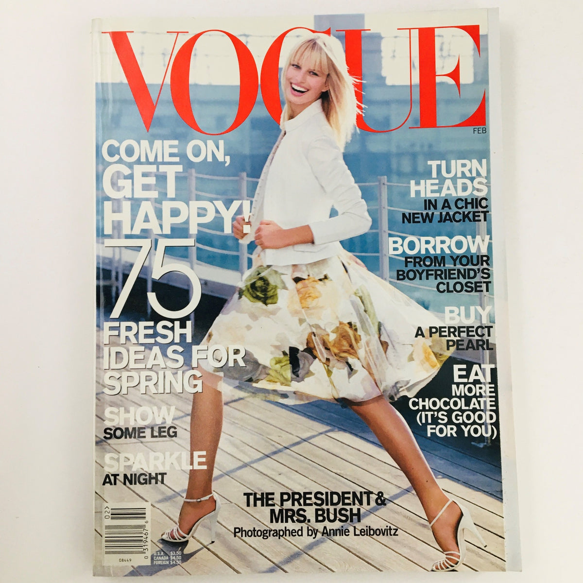 Vogue Magazine February 2001 featuring Czech Model Karolína Kurková on the cover, showcasing a joyful pose in a chic outfit against a scenic background. The magazine emphasizes fresh spring ideas with the tagline 'Come on, get happy!'