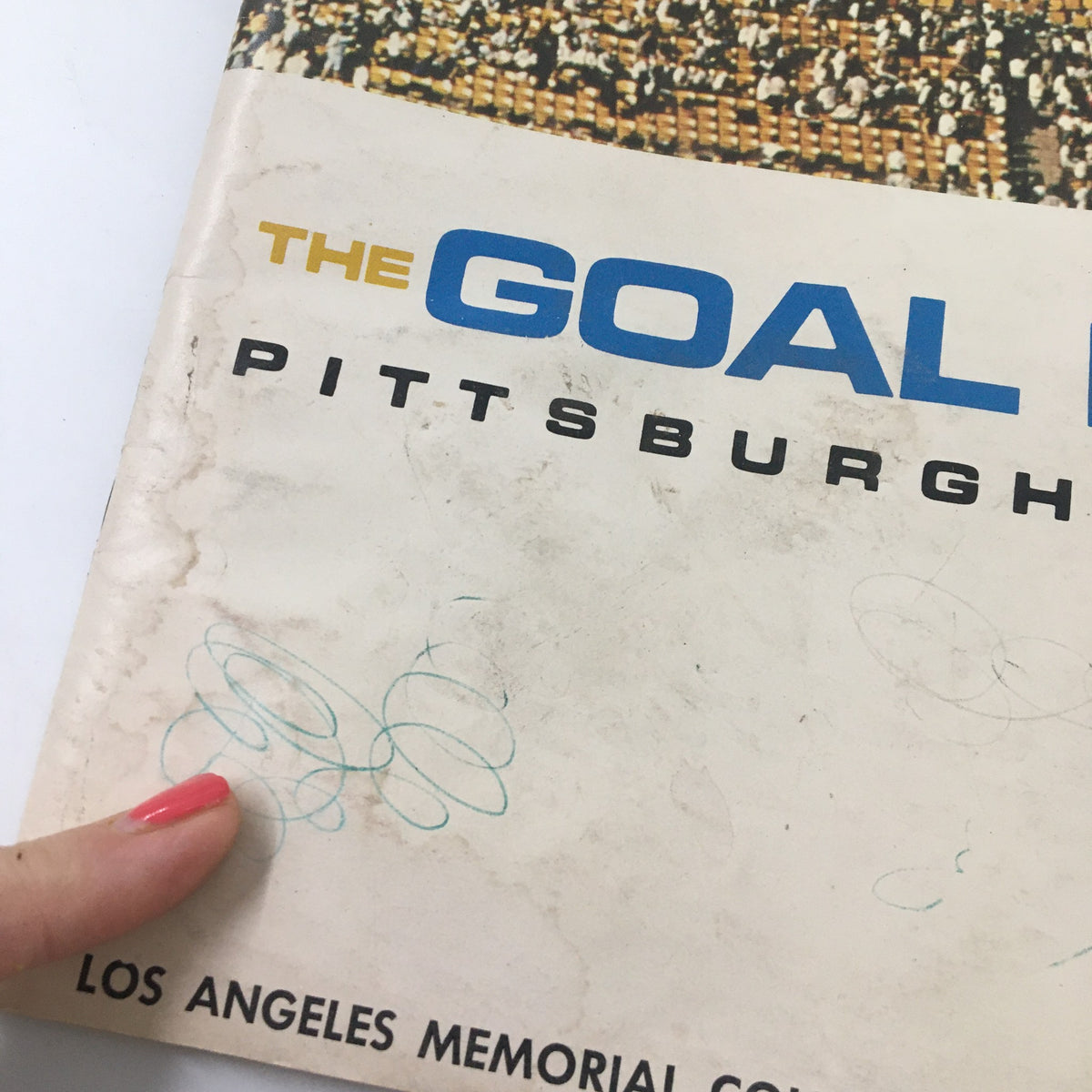 Close-up of the September 17, 1966 NCAA Football Pittsburgh vs UCLA The Goal Post Program cover highlighting wear marks.