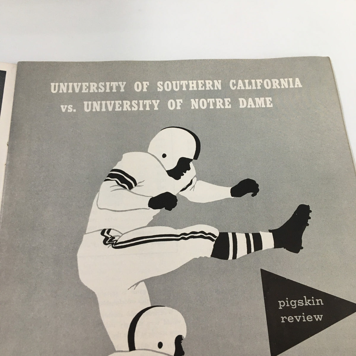 Another interior page of the November 26, 1955 NCAA Football USC vs University of Notre Dame Pigskin Review, featuring the title and description of the famous matchup, showcasing the vintage design.