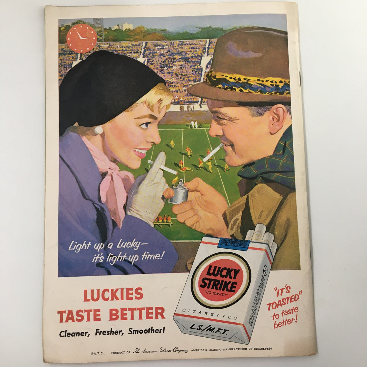 Vintage advertisement from November 26, 1955 NCAA Football USC vs University of Notre Dame Pigskin Review promoting Lucky Strike cigarettes, featuring a couple at a football game which embodies the era's culture.