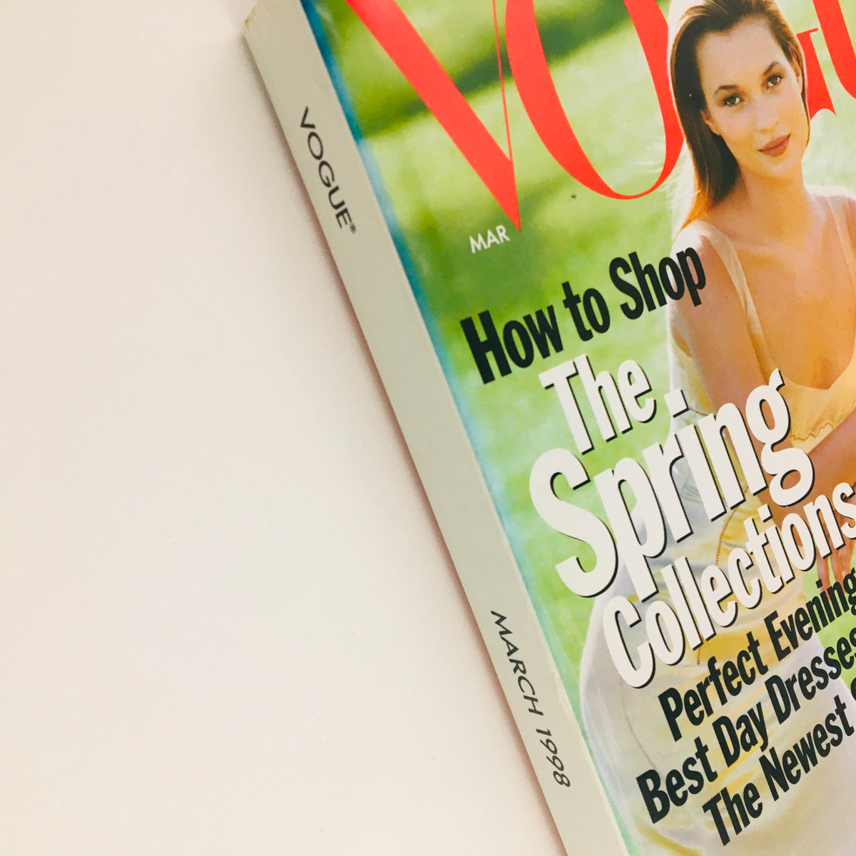 Close-up of Vogue Magazine March 1998 with headlines about Spring Collections, highlighting the fashion of Kate Moss and Amber Valletta.