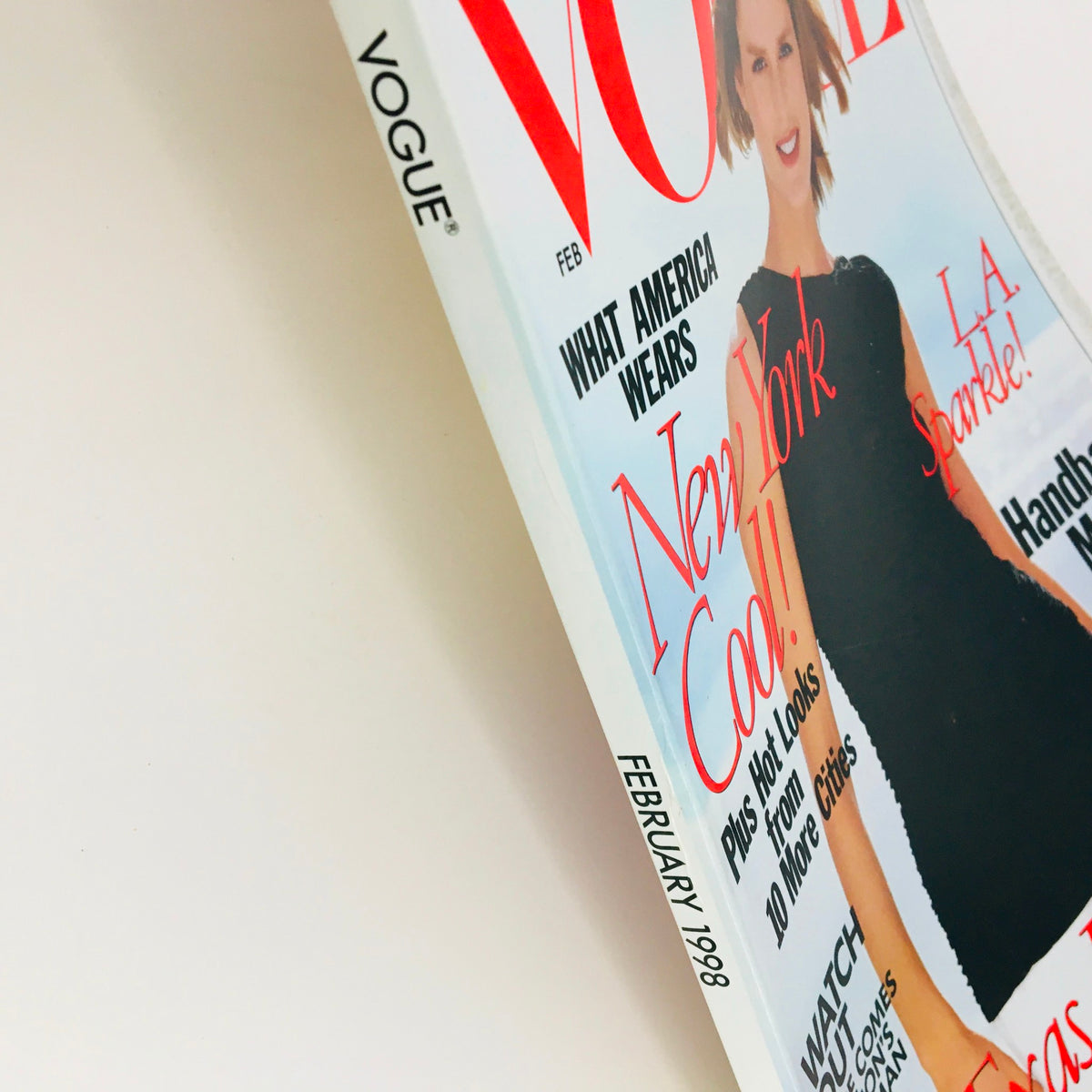 Side view of Vogue Magazine February 1998 featuring American model Carolyn Murphy, highlighting the magazine's title and edition details along with its stylish cover design.
