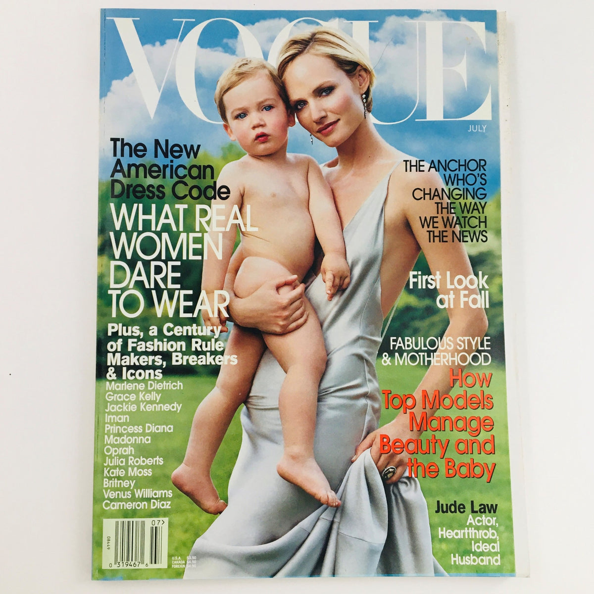 Vogue Magazine July 2002 cover featuring American model and actress Amber Valletta, showcasing iconic fashion and beauty trends of the early 2000s.