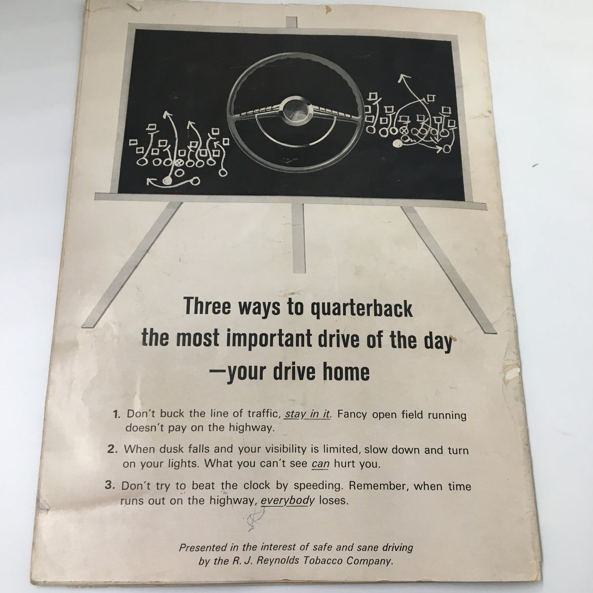 Back cover of the September 20 1963 NCAA Football Pitt vs UCLA The Goal Post Official Program showcasing safety driving tips with a visual of a steering wheel.