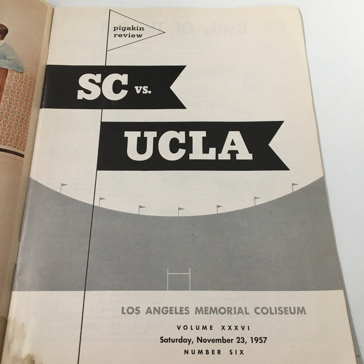 Title page of the November 23 1957 NCAA Football SC Trojans vs UCLA Bruins Pigskin Review, highlighting the matchup at the Los Angeles Memorial Coliseum.