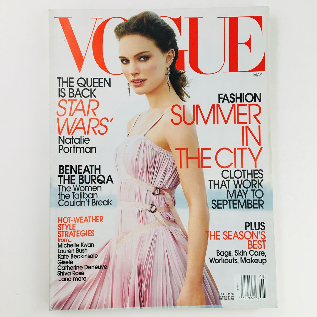 Vogue Magazine May 2002 featuring Israeli-American actress Natalie Portman on the cover, showcasing her in a stunning pink dress with a vibrant editorial layout.
