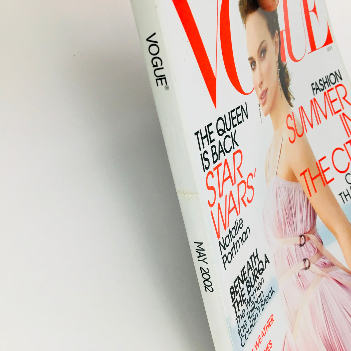 Close-up view of Vogue Magazine May 2002 spine, highlighting the title and the month, with emphasis on Natalie Portman, emphasizing its collectible nature.
