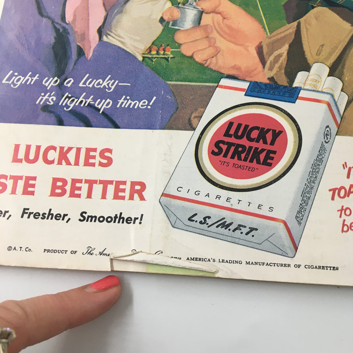 Vintage advertisement for Lucky Strike cigarettes from the 1955 NCAA Football game program, promoting the brand with a cheerful illustration.