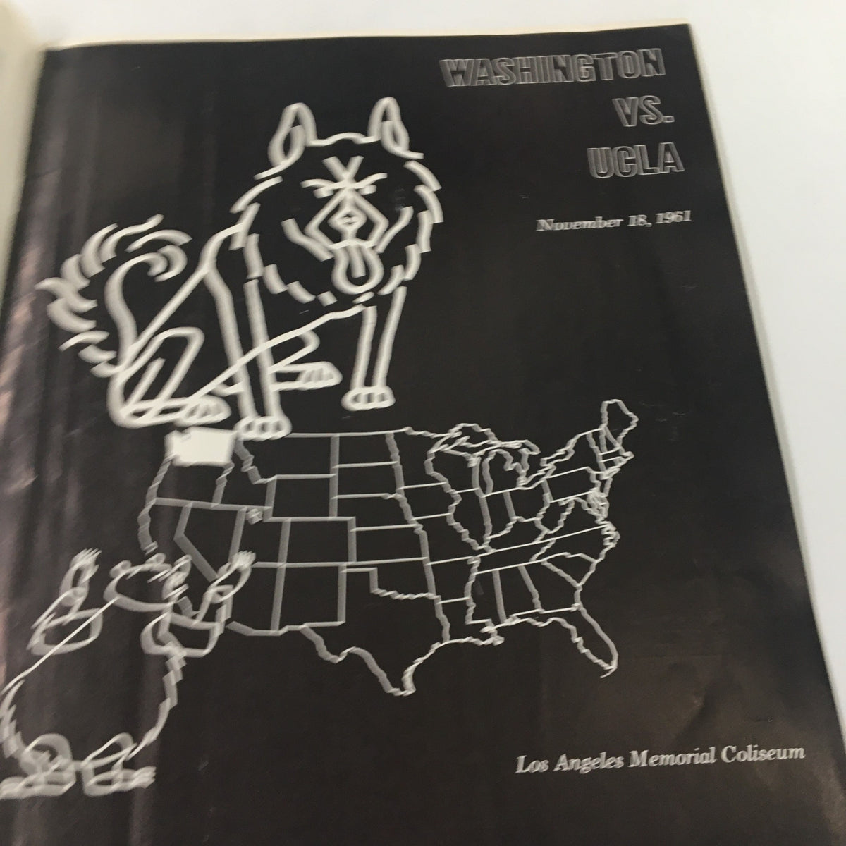 Inside page from the November 18 1961 NCAA Football booklet depicting a graphic map and imagery of the Washington vs UCLA matchup, titled 'The Goal Post'.